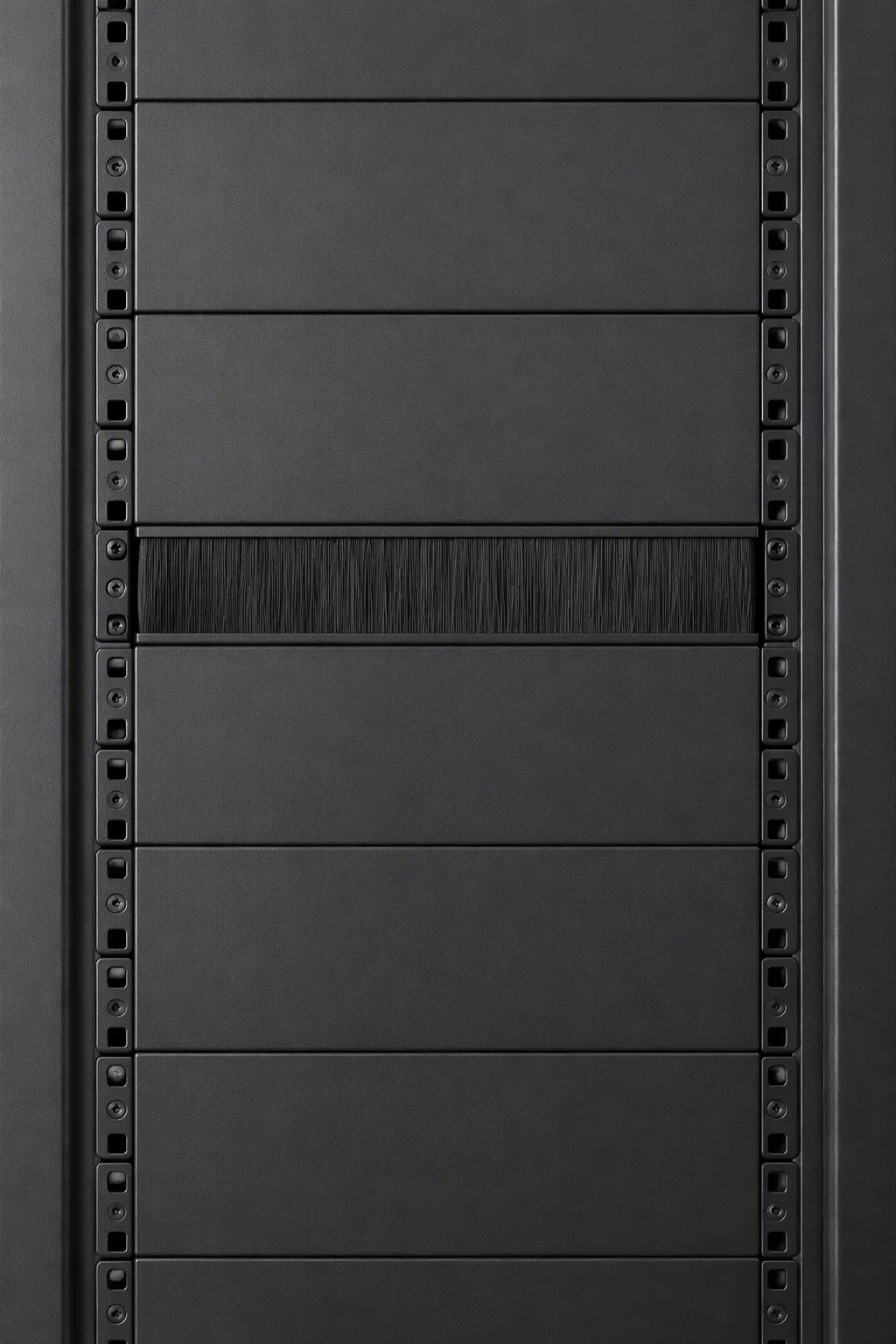 Open rack front with snap-in steel blanking panels fitted next to empty U space, close-up view